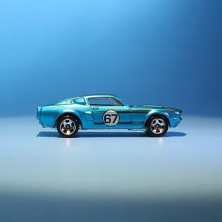 A blue Hot Wheels '67 Shelby GT500 die-cast car